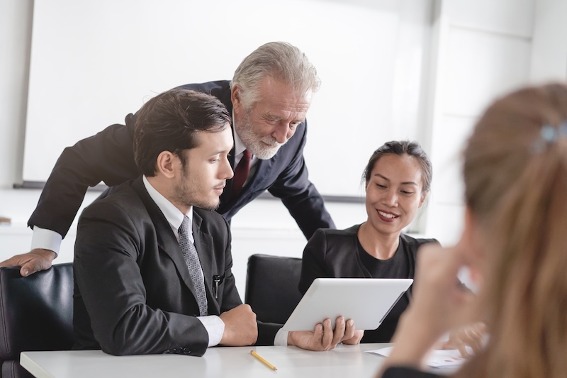 Marketing team consulting sales plan with supervisor senior manager in conference room before presenting to client.</p>
<p>business strategy consulting services